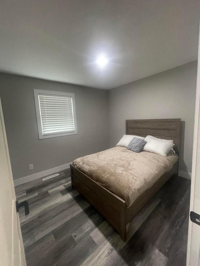 3107 Huntington Dr, Columbus, OH 43207 - bedroom featuring baseboards and dark wood finished floors