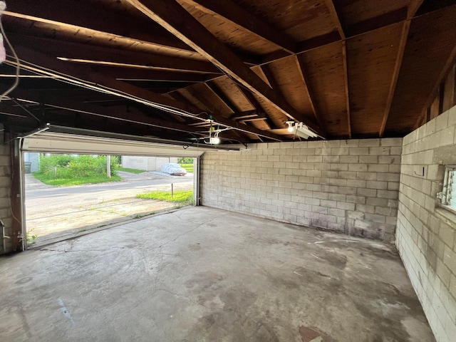 1015 Fairwood Ave, Columbus, OH 43206 - garage with concrete block wall and a garage door opener
