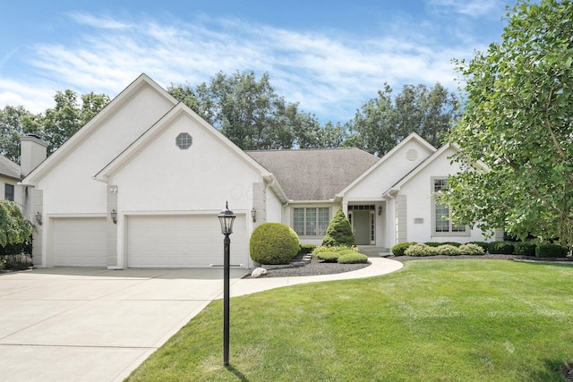 12372 Brook Forest Cir, Pickerington, OH 43147 - view of front of home with an attached garage, driveway, a front yard, and stucco siding