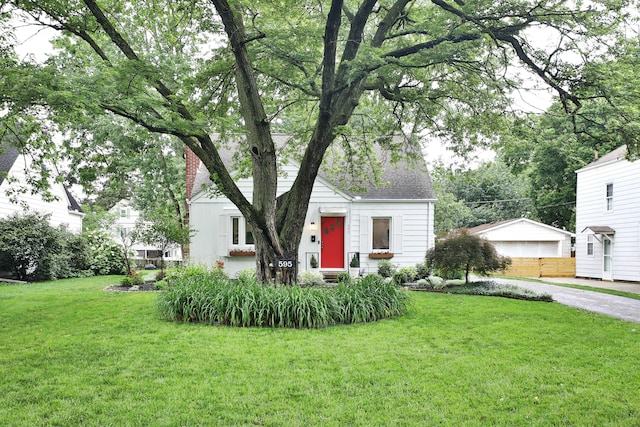 595 Brookside Dr, Columbus, OH 43209 - view of front facade featuring a front yard and a chimney