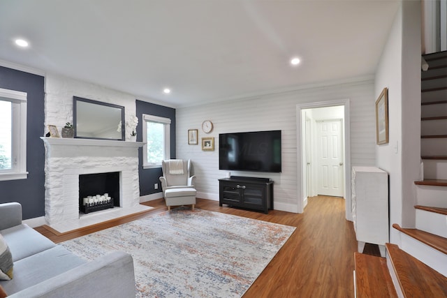 595 Brookside Dr, Columbus, OH 43209 - living room with stairway, wood finished floors, a fireplace, and recessed lighting