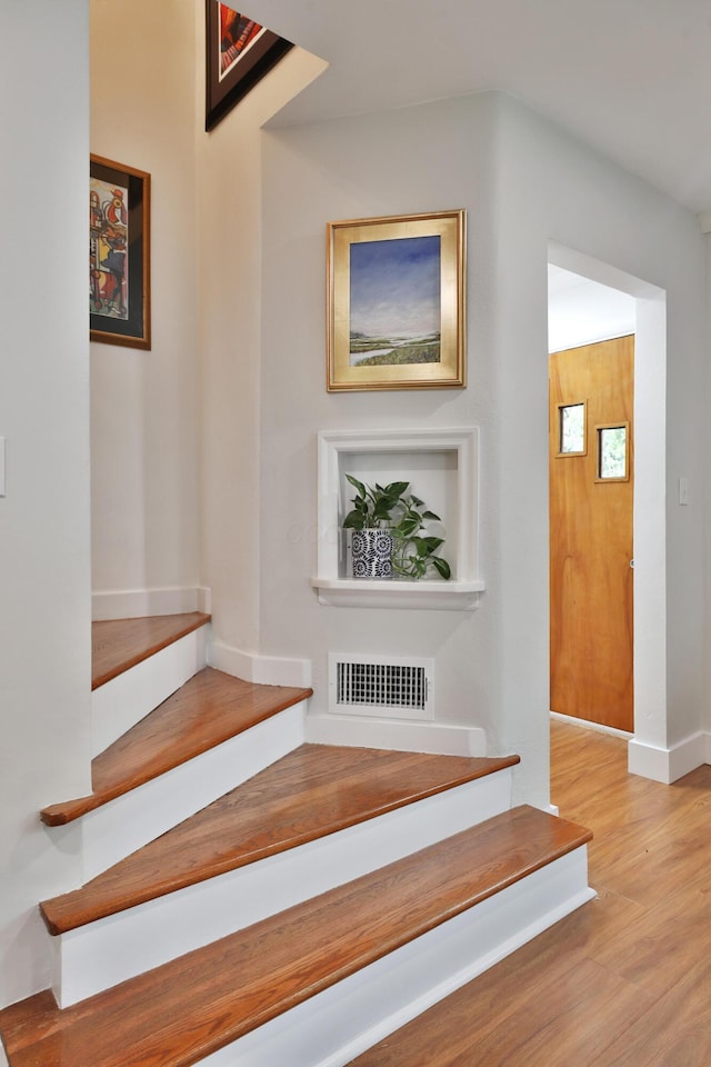 595 Brookside Dr, Columbus, OH 43209 - stairway featuring wood finished floors and baseboards