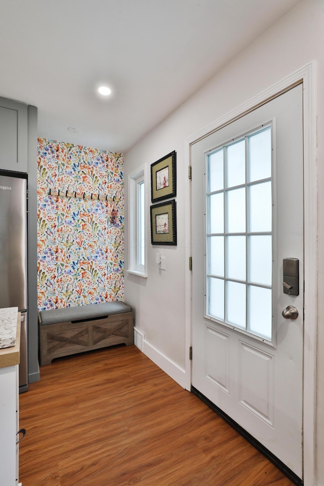 595 Brookside Dr, Columbus, OH 43209 - doorway featuring plenty of natural light, wood finished floors, and wallpapered walls