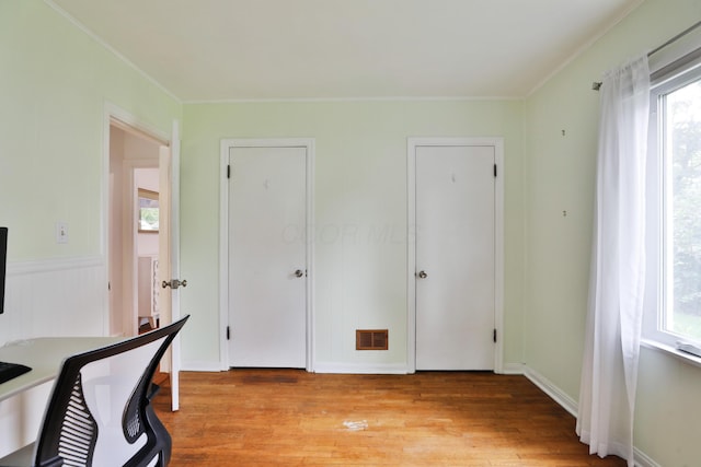 595 Brookside Dr, Columbus, OH 43209 - home office featuring healthy amount of natural light, light wood-type flooring, and crown molding