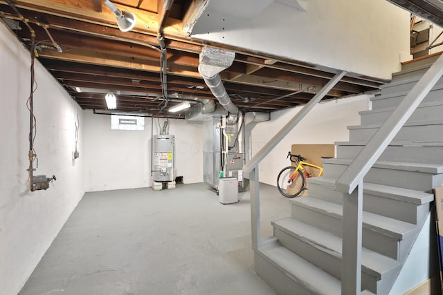 595 Brookside Dr, Columbus, OH 43209 - below grade area with stairway, gas water heater, and heating unit