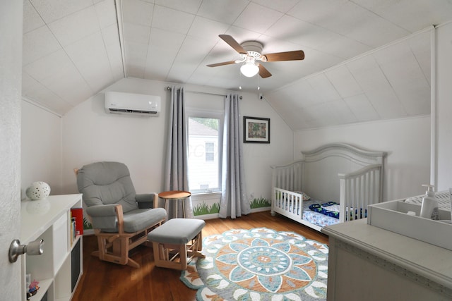 595 Brookside Dr, Columbus, OH 43209 - bedroom featuring a wall unit AC, wood finished floors, lofted ceiling, a crib, and a ceiling fan