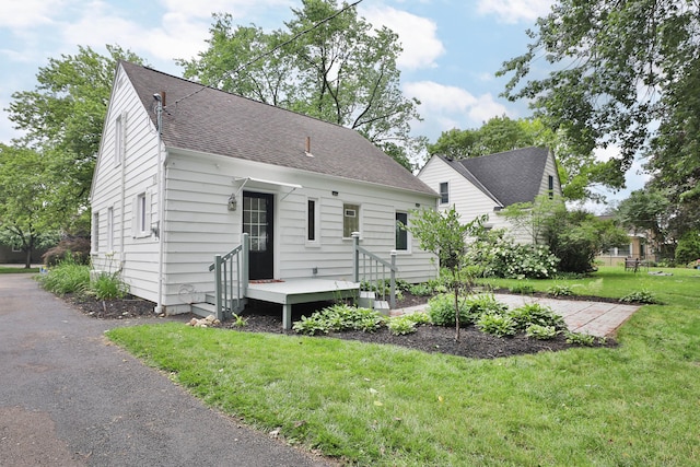 595 Brookside Dr, Columbus, OH 43209 - view of front of home with a front lawn and roof with shingles