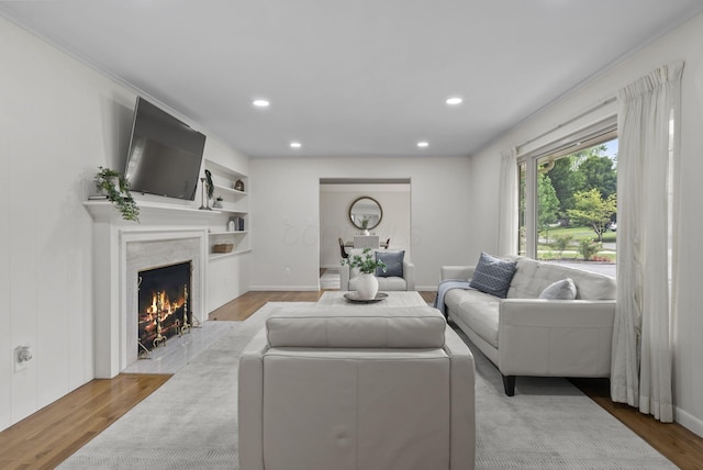4289 Shelbourne Ln, Columbus, OH 43220 - living area with wood finished floors, a premium fireplace, and recessed lighting