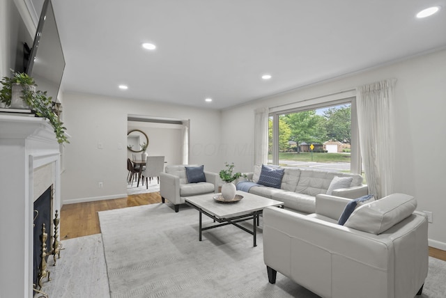 4289 Shelbourne Ln, Columbus, OH 43220 - living room with recessed lighting, wood finished floors, and a high end fireplace