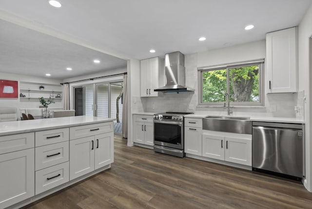 4289 Shelbourne Ln, Columbus, OH 43220 - kitchen with stainless steel appliances, wall chimney exhaust hood, recessed lighting, light countertops, and backsplash