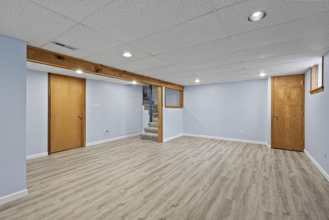 4289 Shelbourne Ln, Columbus, OH 43220 - finished below grade area featuring stairs, light wood-style floors, a paneled ceiling, and recessed lighting