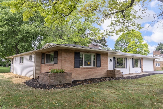 4289 Shelbourne Ln, Columbus, OH 43220 - single story home with a chimney, a front lawn, a garage, and brick siding
