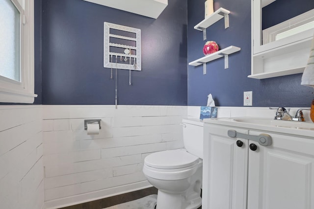 372 Sturbridge Rd, Columbus, OH 43228 - bathroom with a wainscoted wall, vanity, and wood finished floors