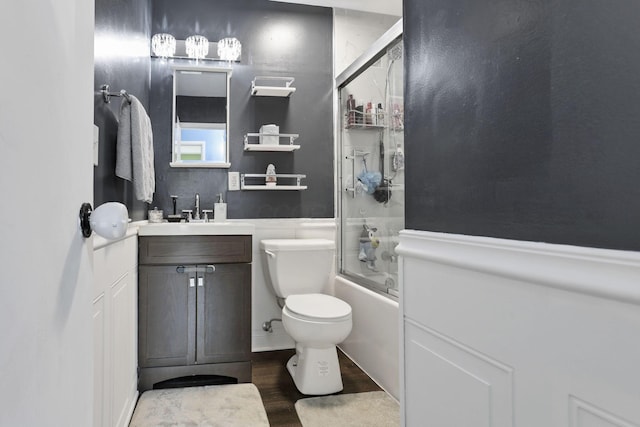 372 Sturbridge Rd, Columbus, OH 43228 - bathroom featuring wood finished floors, vanity, and combined bath / shower with glass door