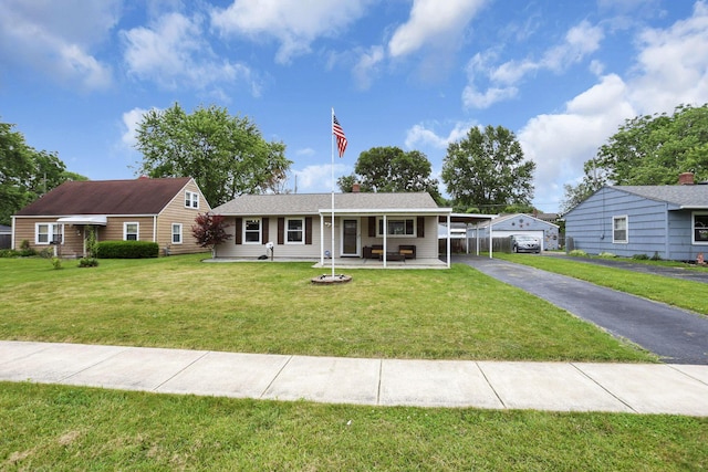 372 Sturbridge Rd, Columbus, OH 43228 - single story home with a front lawn, driveway, a carport, and covered porch