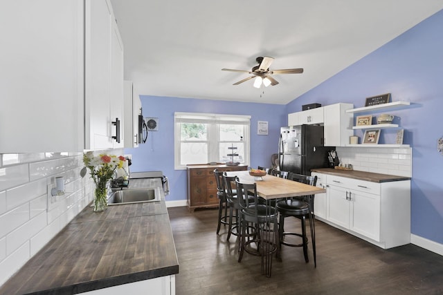 372 Sturbridge Rd, Columbus, OH 43228 - dining area with a ceiling fan, dark wood finished floors, and lofted ceiling