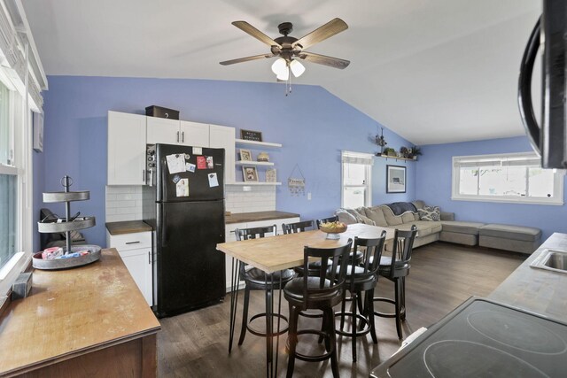 372 Sturbridge Rd, Columbus, OH 43228 - dining space with vaulted ceiling, dark wood-type flooring, and ceiling fan