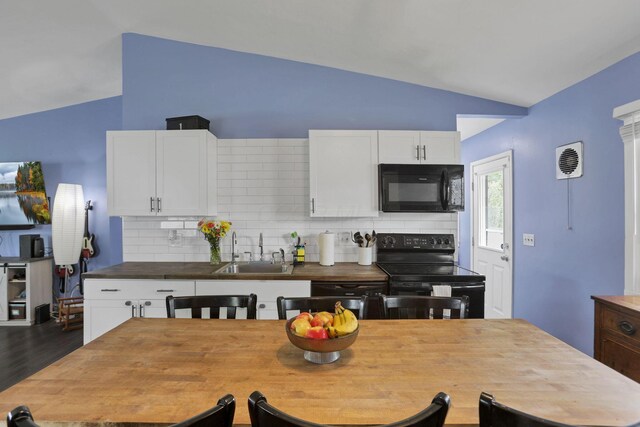 372 Sturbridge Rd, Columbus, OH 43228 - kitchen featuring black appliances, lofted ceiling, backsplash, white cabinets, and dark wood-style floors