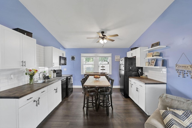 372 Sturbridge Rd, Columbus, OH 43228 - kitchen with vaulted ceiling, black appliances, wood counters, ceiling fan, and tasteful backsplash