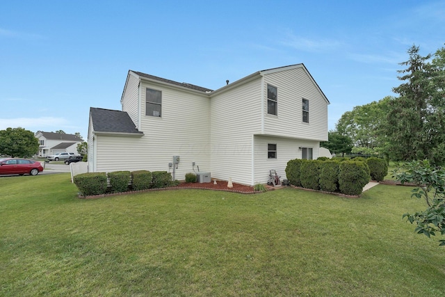 50 Bazler Ln, South Bloomfield, OH 43103 - view of side of home with a lawn and a shingled roof