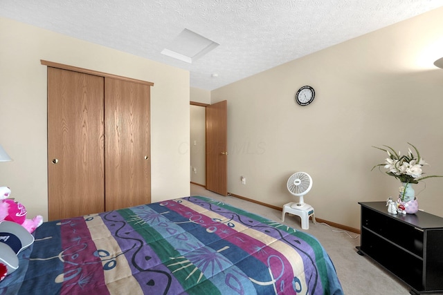 50 Bazler Ln, South Bloomfield, OH 43103 - bedroom with light carpet, a closet, a textured ceiling, and attic access