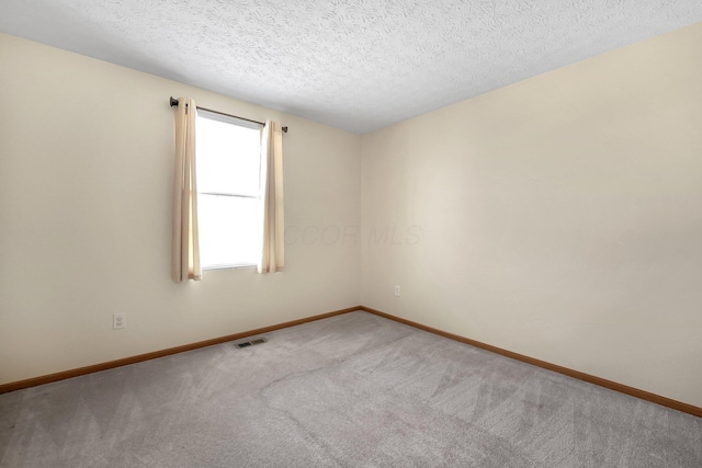 50 Bazler Ln, South Bloomfield, OH 43103 - carpeted spare room featuring baseboards and a textured ceiling