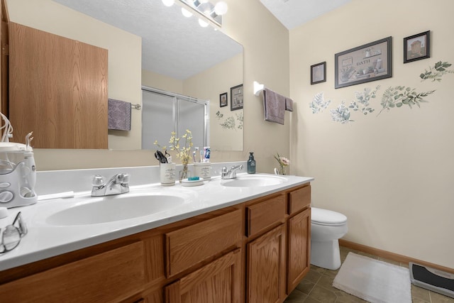50 Bazler Ln, South Bloomfield, OH 43103 - full bathroom with double vanity, tile patterned floors, and a stall shower