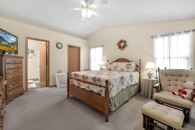 50 Bazler Ln, South Bloomfield, OH 43103 - bedroom featuring light colored carpet, vaulted ceiling, ensuite bath, and ceiling fan