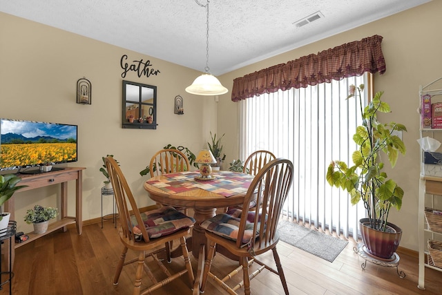 50 Bazler Ln, South Bloomfield, OH 43103 - dining space featuring light wood-type flooring and a textured ceiling