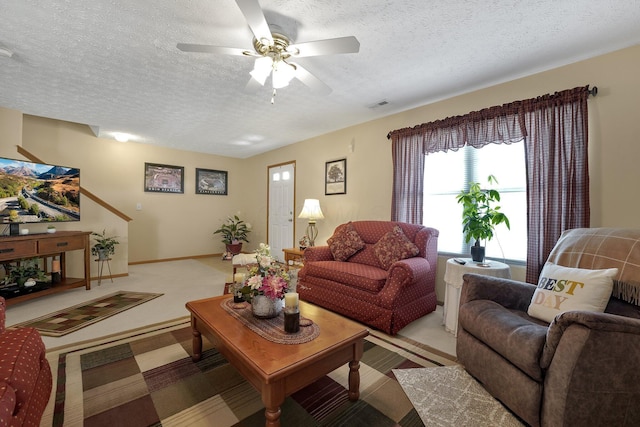 50 Bazler Ln, South Bloomfield, OH 43103 - living area featuring a textured ceiling, light colored carpet, and ceiling fan