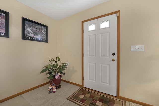 50 Bazler Ln, South Bloomfield, OH 43103 - foyer featuring baseboards and light tile patterned floors