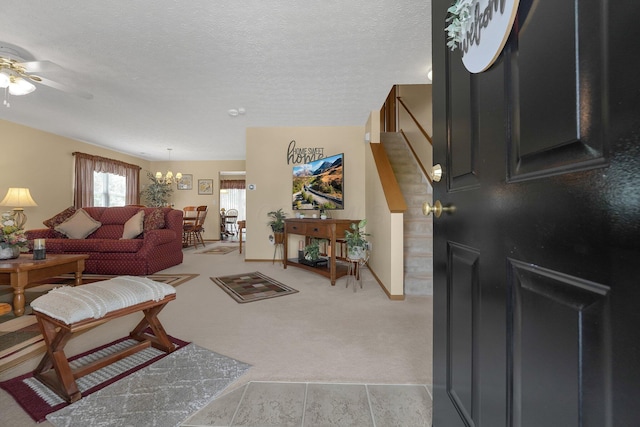 50 Bazler Ln, South Bloomfield, OH 43103 - living area with a ceiling fan, light colored carpet, a chandelier, a textured ceiling, and stairway