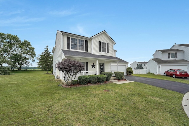 50 Bazler Ln, South Bloomfield, OH 43103 - traditional-style home featuring driveway, covered porch, a front yard, and a garage