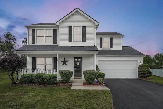 50 Bazler Ln, South Bloomfield, OH 43103 - traditional-style home featuring asphalt driveway, a porch, a yard, a garage, and a shingled roof
