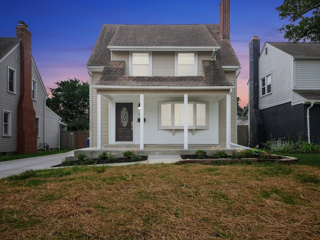 3017 Wicklow Rd, Columbus, OH 43204 - view of front of property with a porch, roof with shingles, and a front yard
