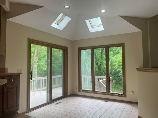 471 Old Mill Dr, Columbus, OH 43230 - doorway with a skylight, light tile patterned flooring, vaulted ceiling, and recessed lighting