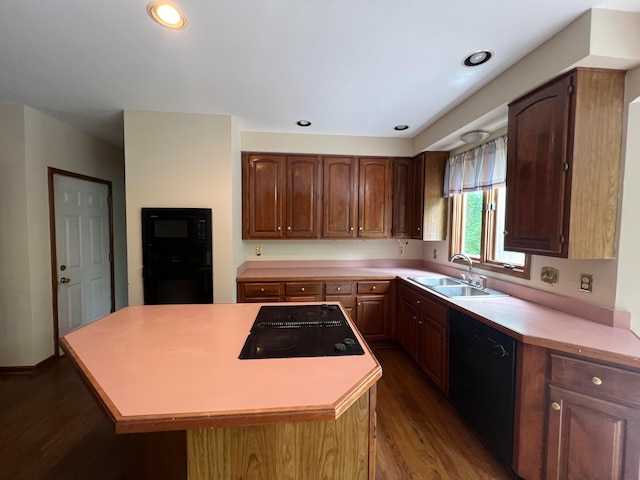 471 Old Mill Dr, Columbus, OH 43230 - kitchen featuring black appliances, dark wood-type flooring, light countertops, and a center island