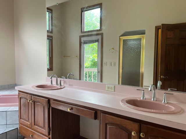 471 Old Mill Dr, Columbus, OH 43230 - full bathroom featuring double vanity, a bath, a stall shower, and a high ceiling
