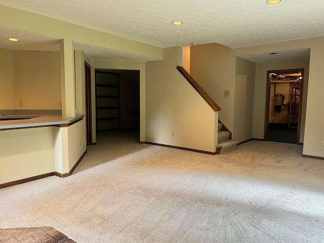 471 Old Mill Dr, Columbus, OH 43230 - unfurnished living room with light carpet, stairs, recessed lighting, and a textured ceiling