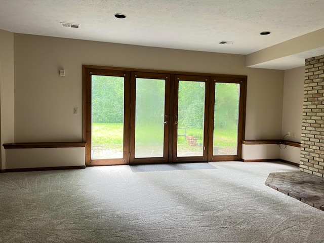 471 Old Mill Dr, Columbus, OH 43230 - spare room featuring carpet, healthy amount of natural light, and a textured ceiling