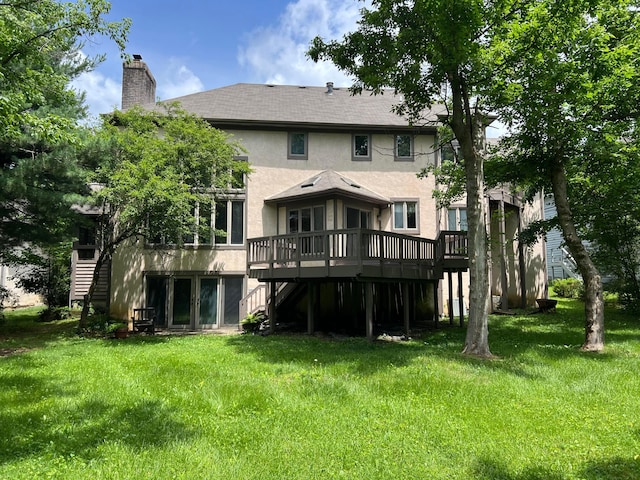 471 Old Mill Dr, Columbus, OH 43230 - back of house featuring stucco siding, a wooden deck, a chimney, and a lawn