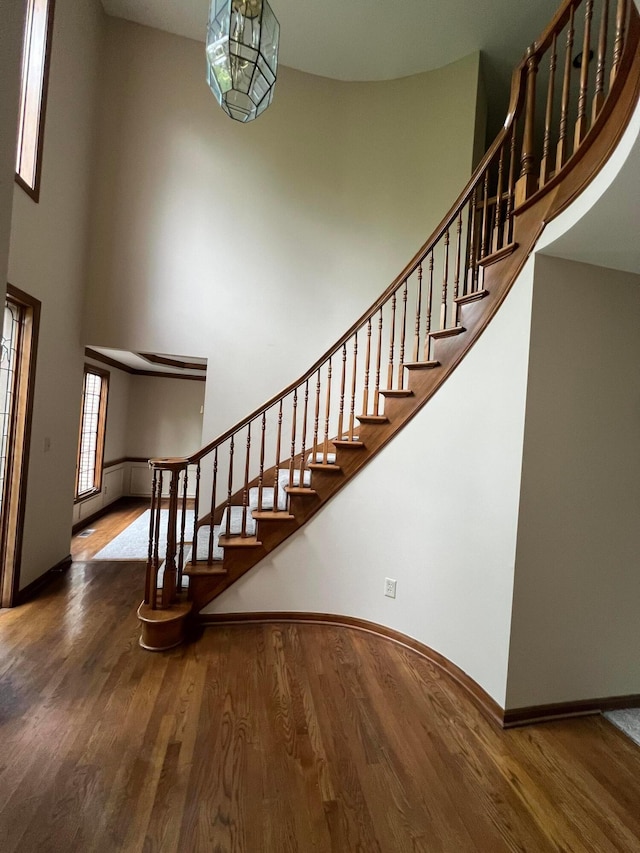 471 Old Mill Dr, Columbus, OH 43230 - staircase featuring wood finished floors and a towering ceiling