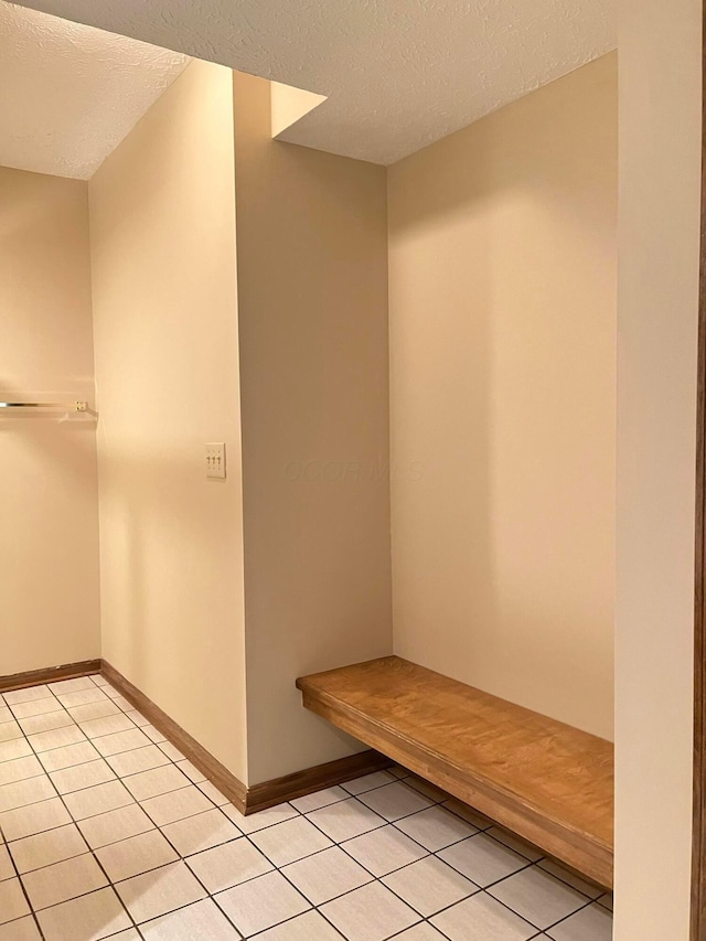 471 Old Mill Dr, Columbus, OH 43230 - mudroom with a textured ceiling and light tile patterned floors