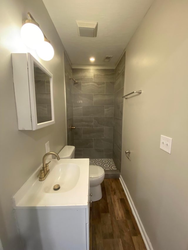 128 S Princeton Ave, Columbus, OH 43222 - bathroom with a shower stall, wood finished floors, and vanity