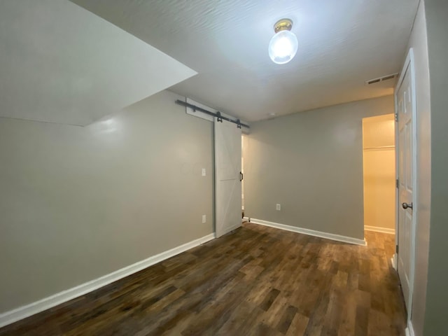 128 S Princeton Ave, Columbus, OH 43222 - additional living space featuring a barn door and dark wood-style floors