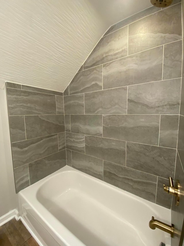 128 S Princeton Ave, Columbus, OH 43222 - bathroom featuring lofted ceiling and washtub / shower combination