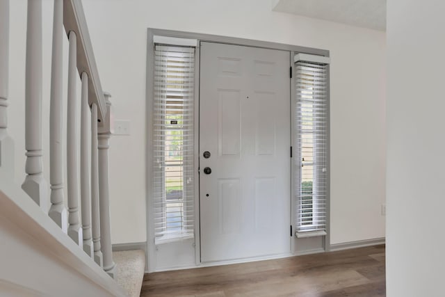 8139 Storrow Dr, Westerville, OH 43081 - entryway with wood finished floors, plenty of natural light, and stairs