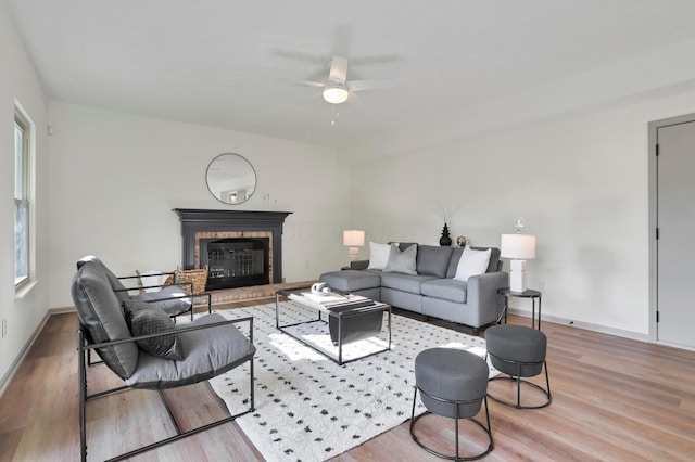 8139 Storrow Dr, Westerville, OH 43081 - living room with a ceiling fan, wood finished floors, and a brick fireplace