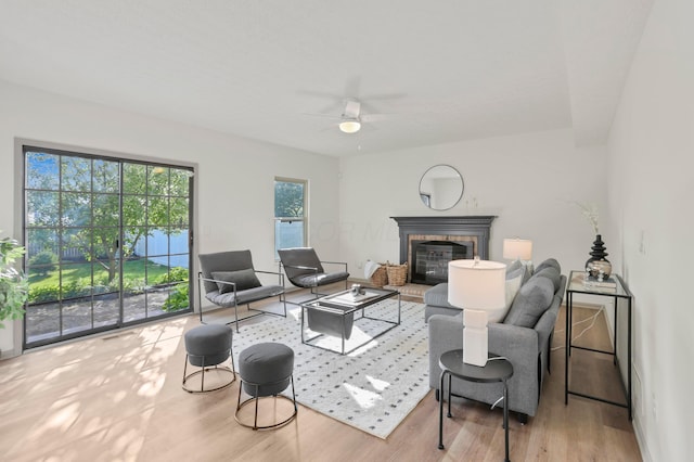 8139 Storrow Dr, Westerville, OH 43081 - living room featuring ceiling fan, wood finished floors, and a glass covered fireplace
