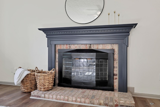 8139 Storrow Dr, Westerville, OH 43081 - detailed view of a brick fireplace and wood finished floors
